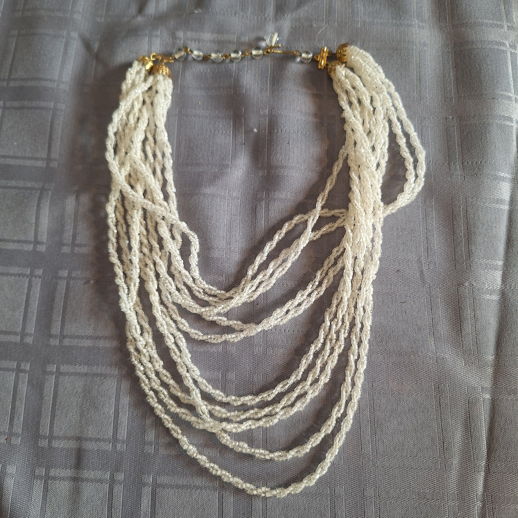 10 STRAND WHITE SEED BEAD 17 NECKLACE.  9