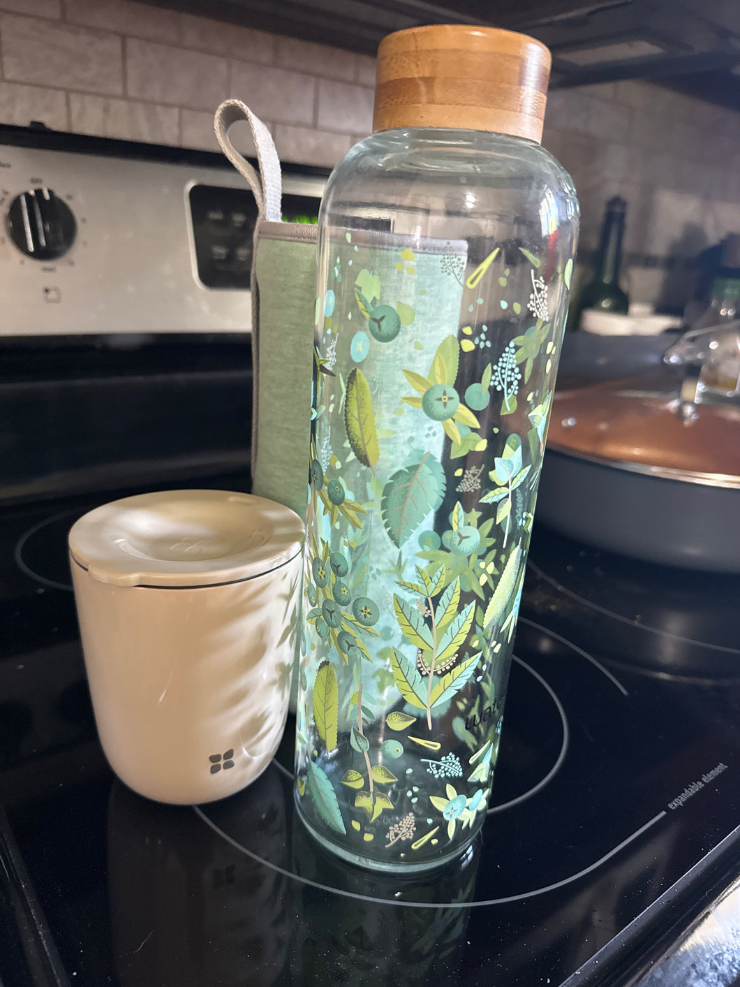 Water drop glass bottle W/ sleeve & metal cup w/