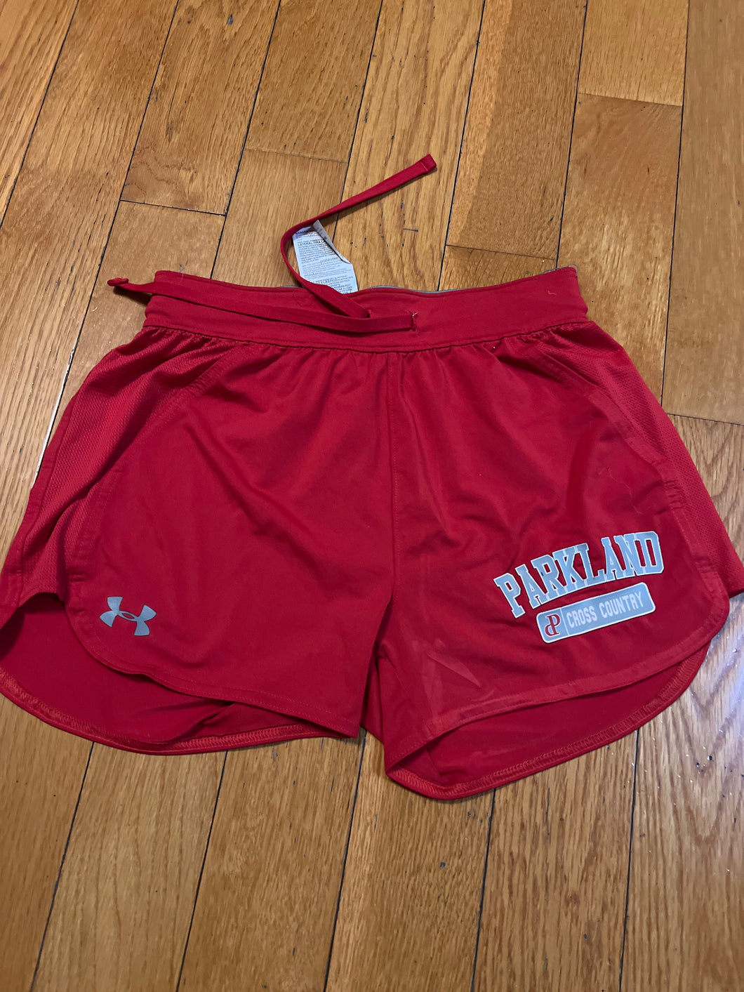 UNDER ARMOUR SHORTS RED-PARKLAND XC - size Junior Girls XS (0-1)