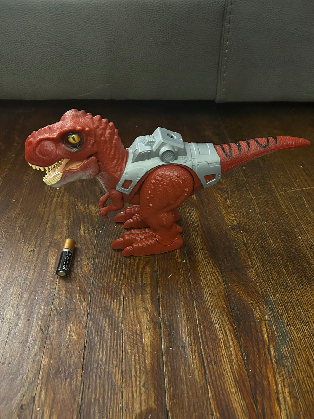 Red electronic Dinosaur Walks Roars lights up