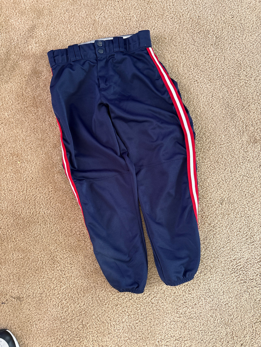 Navy blue softball pants w/ red stripes - size Kids 10
