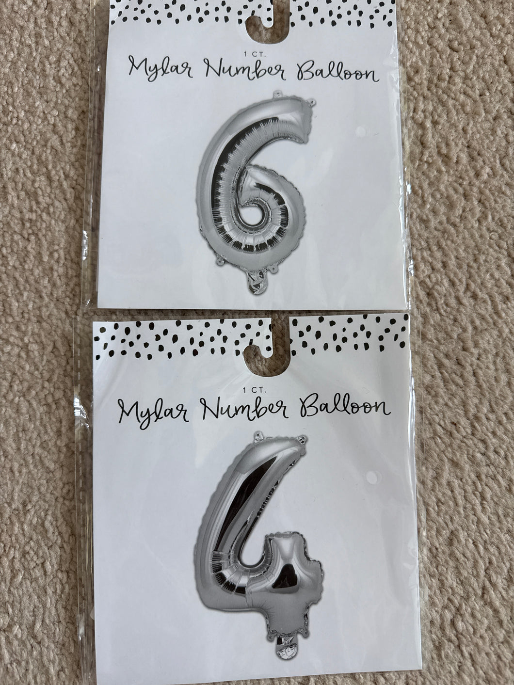 2 silver Mylar balloons 6 and 4