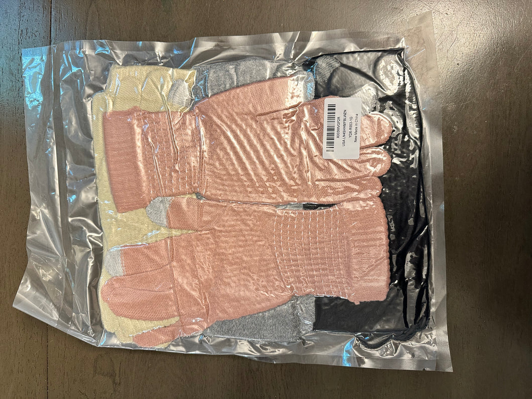 Four pack of gloves Brand new in packaging