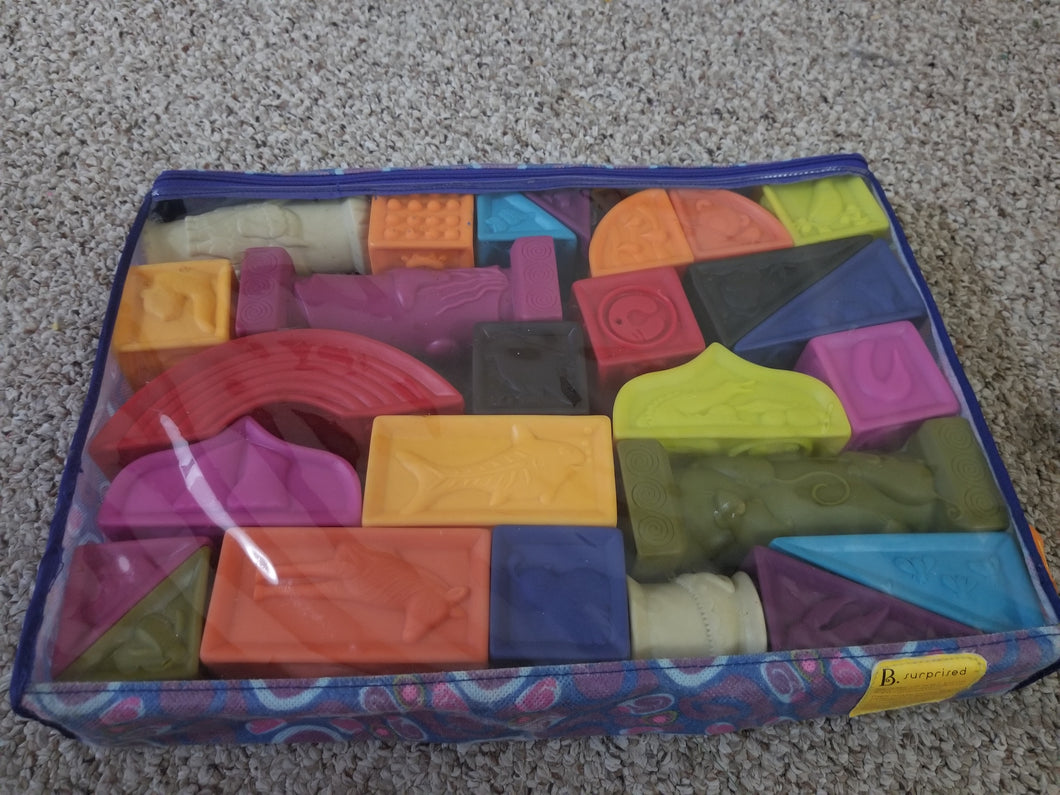 B. alphabet blocks Soft plastic w/texture