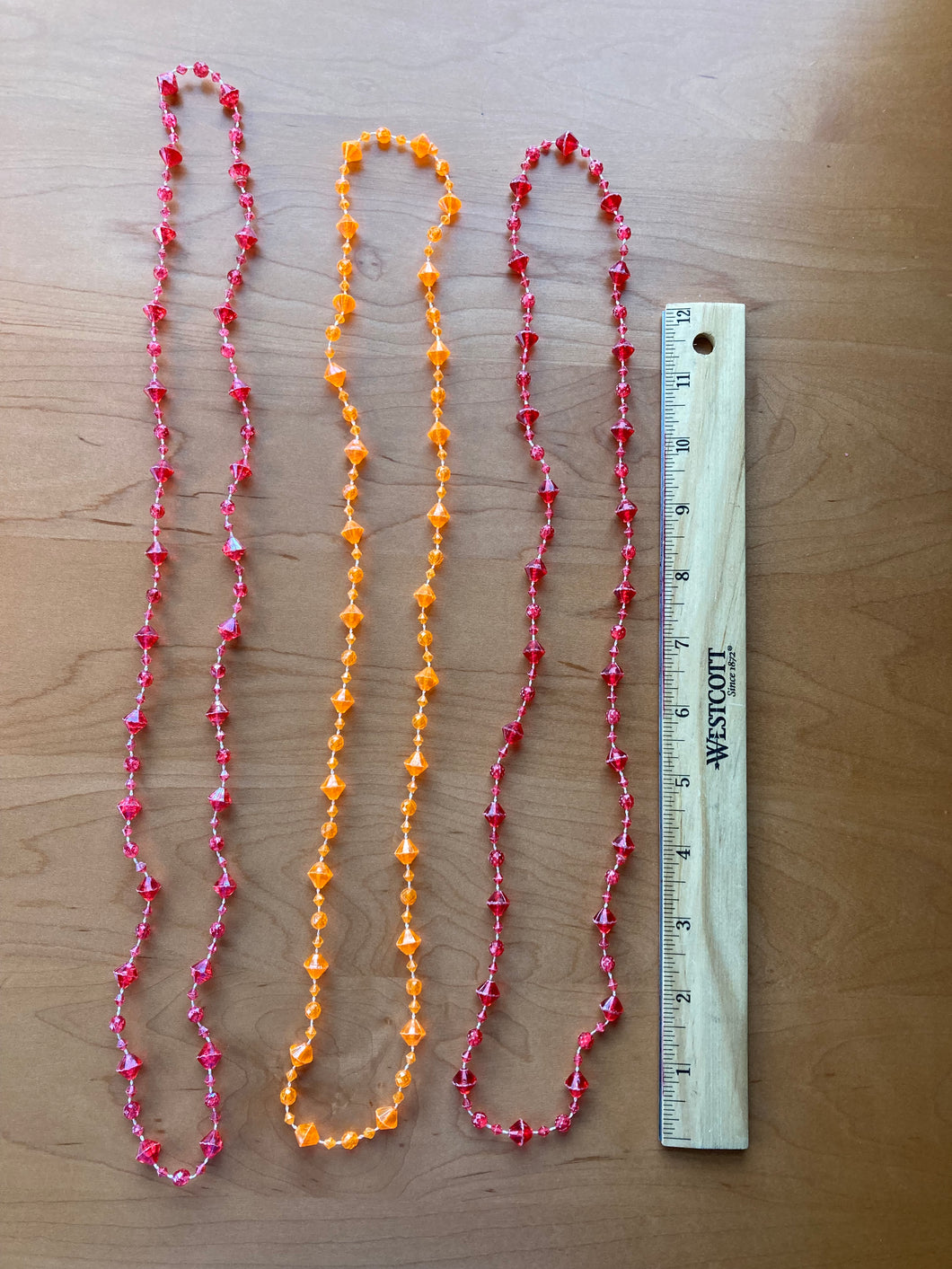Dress up necklaces 2 red and 1 orange
