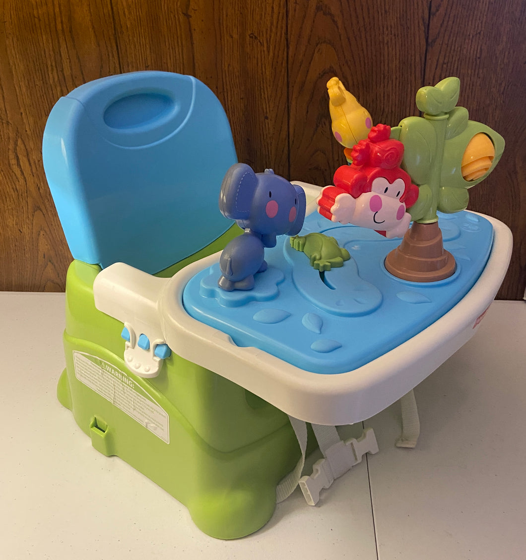 Fisher price booster chair with toy attatched