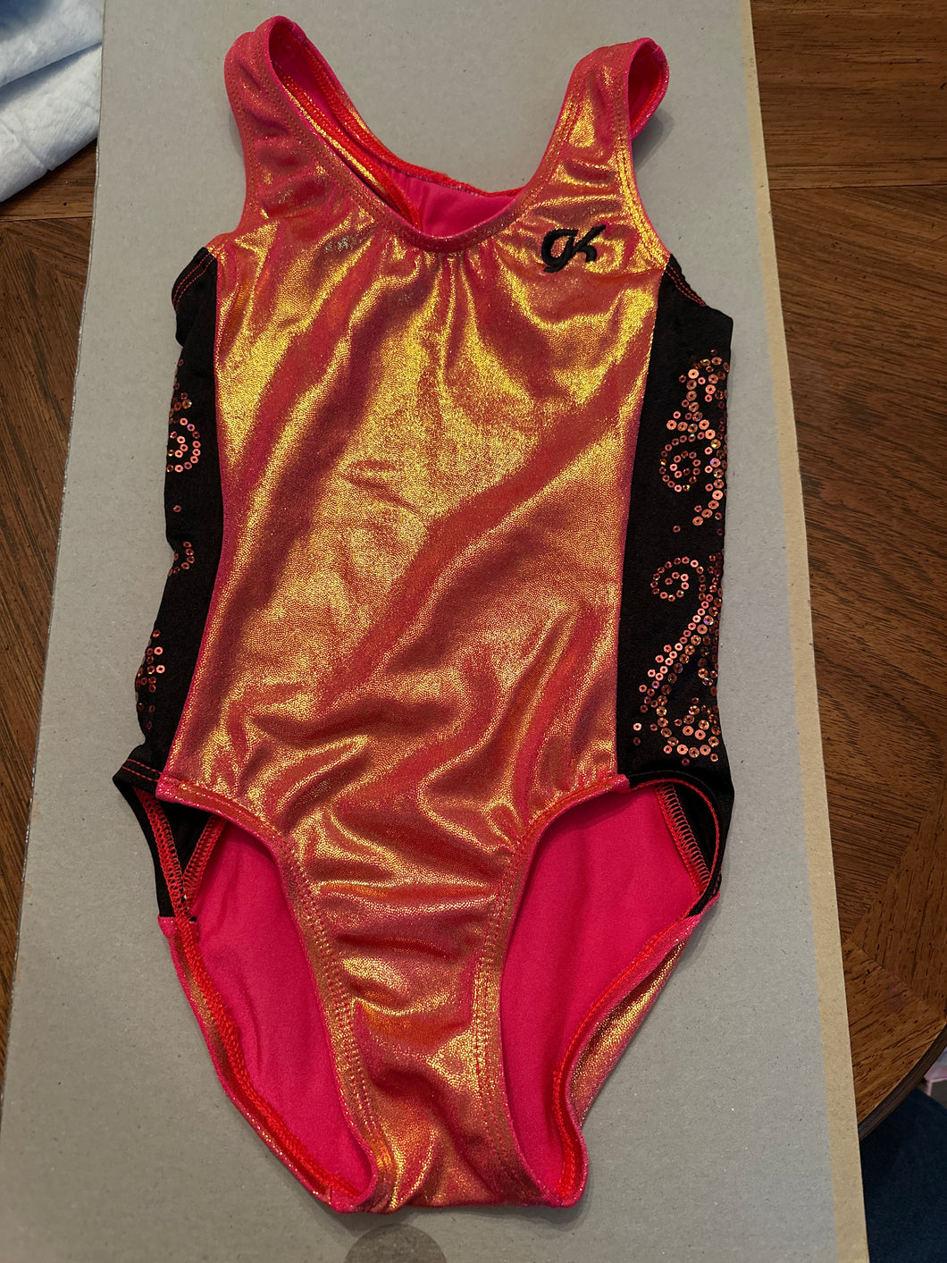 Gk leotard Orange with black side s - size Kids 6